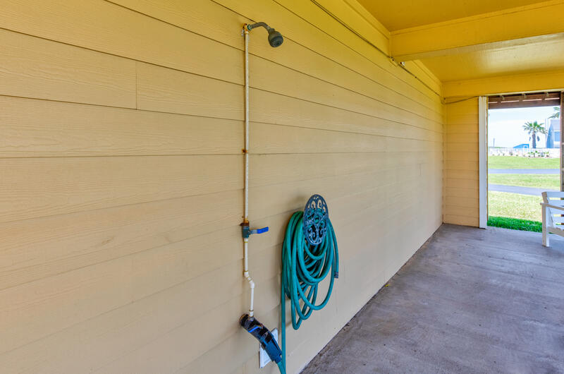 Outdoor rinse-off shower under the house