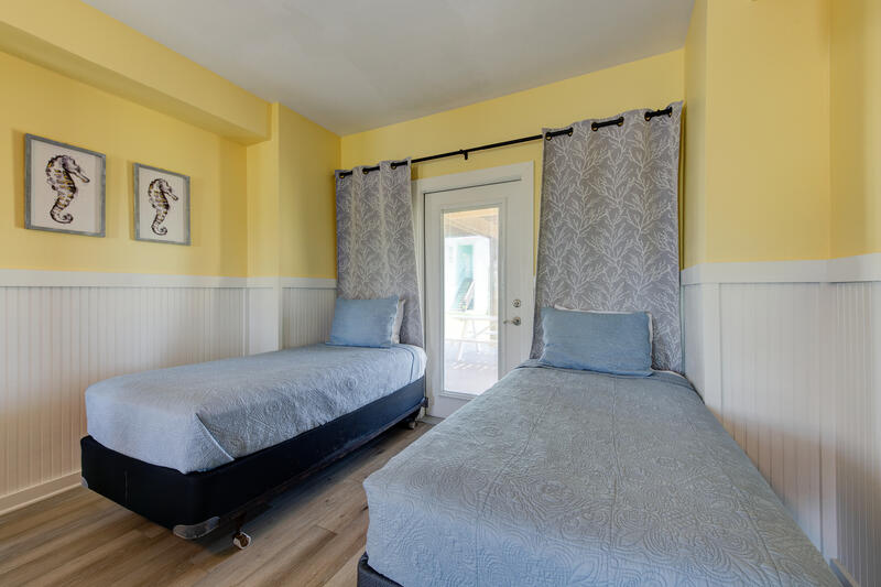 Twin beds by the first-floor patio door