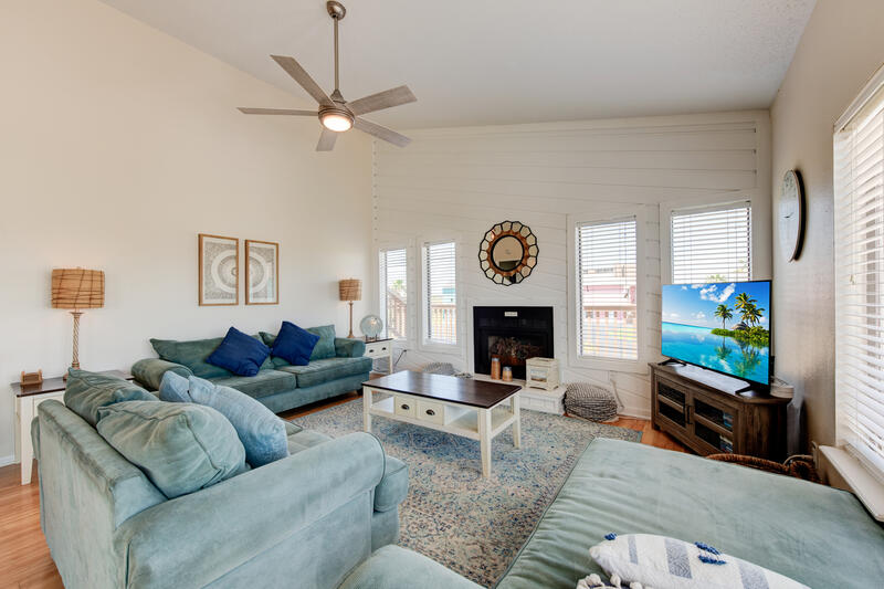 Living room seating with fireplace and TV