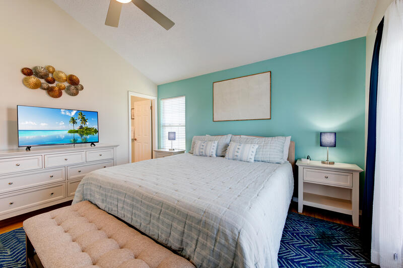 Bedroom with king bed and TV