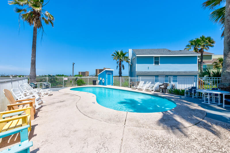 Community pool with lounge chairs